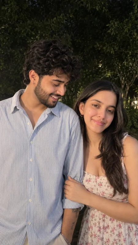 Natural couple selfie outdoors with casual outfits