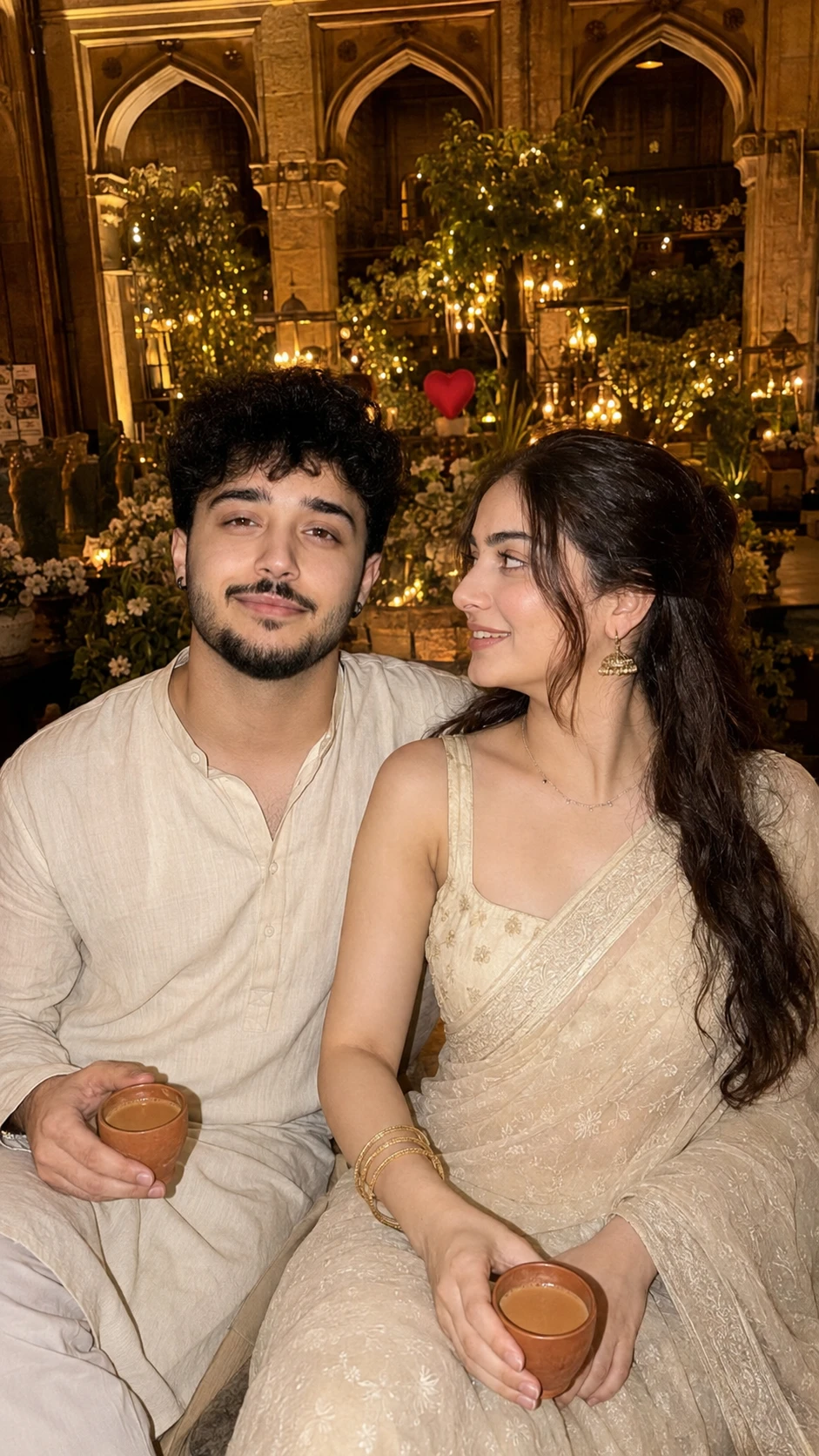Ultra-realistic couple portrait in traditional outfits with chai